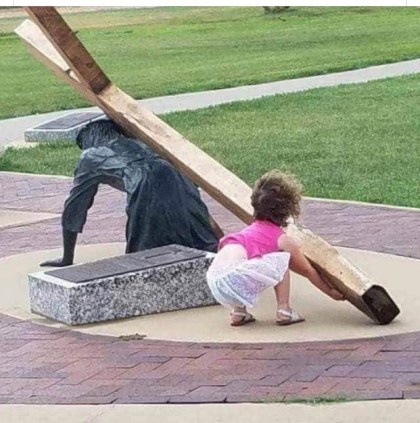 girl carrying the cross